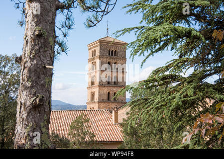 View of Saint Scholastica medieval monastery surrounded, by trees in Subiaco. Founded by Benedict of Nursia Stock Photo