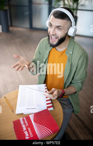 Student feeling joyful while studying foreign language Stock Photo