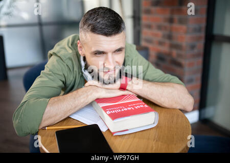 Bearded student feeling excited before passing language exam Stock Photo