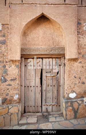Old door in an earth house, adobe, Oman, Arabian Peninsula, Middle East Stock Photo