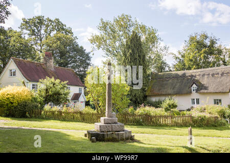 The village green and thatched cottages at Earl Soham, Suffolk, England, UK Stock Photo