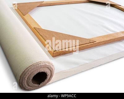 Closeup wooden frame on roll white artist cotton canvas prepare for stretching. Stock Photo