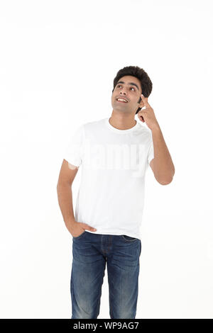 Man Using Something Young man watching out for something, portrait Stock Photo - Alamy