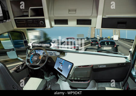 Self driving truck with head up display on a road. Inside view. Stock Photo