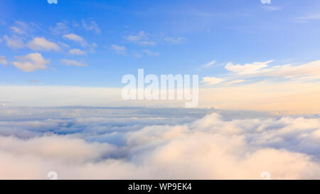 Aerial view White clouds in blue sky. Top view. View from drone. Aerial bird's eye view. Aerial top view cloudscape. Texture of clouds. View from abov Stock Photo