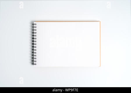 A notebook on a spring. Isolated on white background. Stock Photo