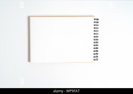 A notebook on a spring. Isolated on white background. Stock Photo