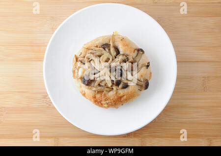 mushrooms pizza focaccia bread on plate isolated on cutting board table Stock Photo