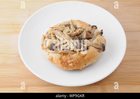 mushrooms pizza focaccia bread on plate isolated on cutting board table Stock Photo