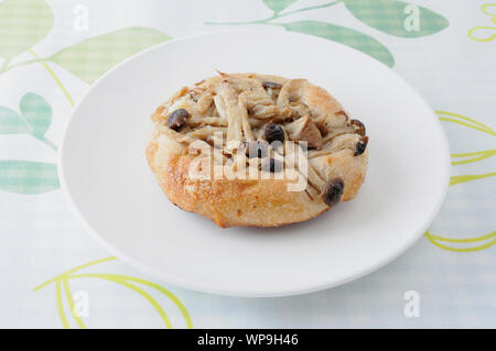 mushrooms pizza focaccia bread on plate isolated on cutting board table Stock Photo