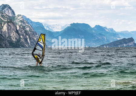 Lake Garda, Italy - July 31, 2019: Man windsurfing on lake garda in Italy Stock Photo