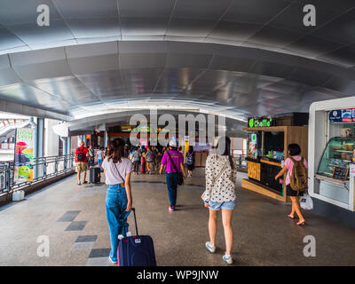 BANGKOK, THAILAND - MAY 6,2017 : Unidentified  passengers walk to BTS Skytrain from the Suvarnabhumi Airport Rail Link Train at Phayathai Station on M Stock Photo