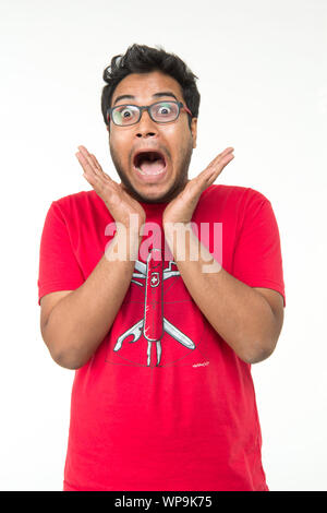 Young man looking shocked Stock Photo