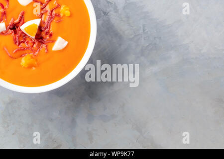 Salmorejo, Spanish cold tomato soup, close-up overhead shot with a place for text Stock Photo