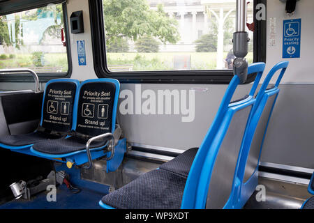 priority seating at the front of a cta bus in Chicago Illinois USA Stock Photo