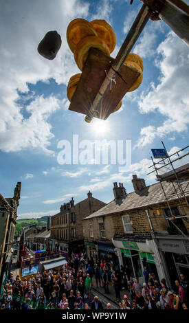 Competitors throw black puddings to knock down Yorkshire puddings during the annual World Black Pudding Throwing Championships in Ramsbottom, Lancashire. Stock Photo