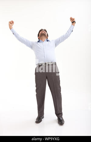 Young man celebrating his success Stock Photo