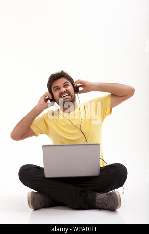 Man wearing headphones looking frustrated Stock Photo