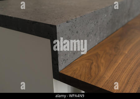 Closeup detail shot of gray terrazzo kitchen countertop with black marble, shallow focus Stock Photo