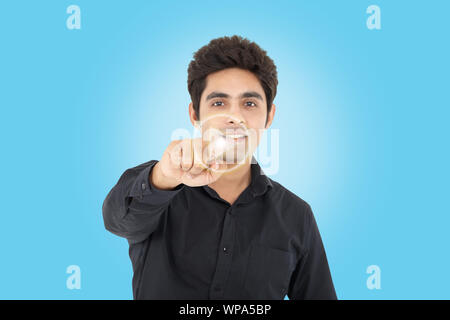 Businessman pressing startplay button on virtual screen Stock Photo