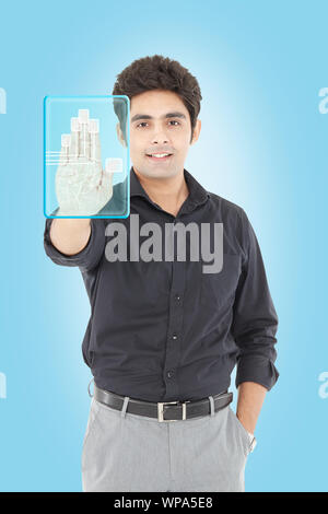 Businessman using a touch screen for biometrics identification Stock Photo