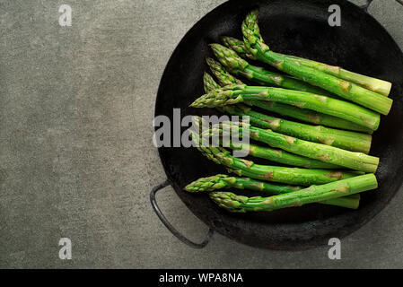 Fresh of green Asparagus. Cooking healthy meal in pan. Bunches of green asparagus Stock Photo