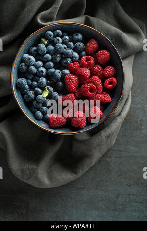 Berries overhead closeup colorful assorted mix of blueberry and raspberry Stock Photo