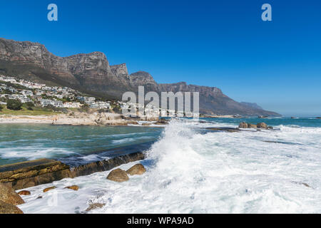 Camps Bay with Twelve Apostles Mountains in the foreground, Cape Town, Western Cape, South Africa Stock Photo