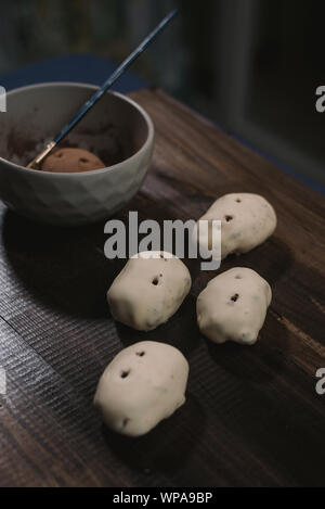 cooking potato cake on a dark wooden background. cooking rum ball Stock Photo