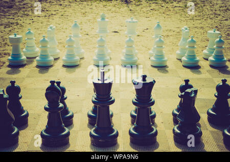 giant chess pieces on the beach Stock Photo