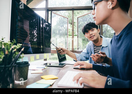 Programmers and developer teams are coding and developing software. Stock Photo