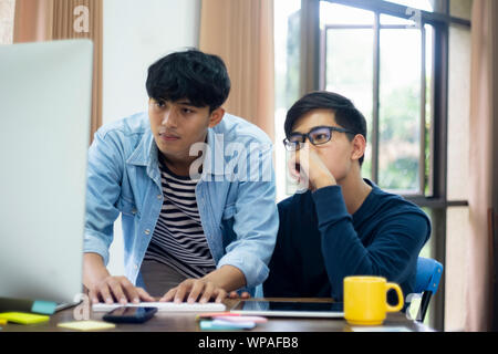 Programmers and developer teams are coding and developing software. Stock Photo