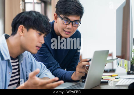 Programmers and developer teams are coding and developing software. Stock Photo