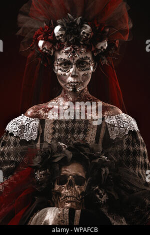 Santa Muerte Halloween Young Girl with creative scull Makeup Stock Photo