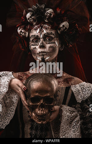 Santa Muerte Halloween Young Girl with creative scull Makeup Stock Photo