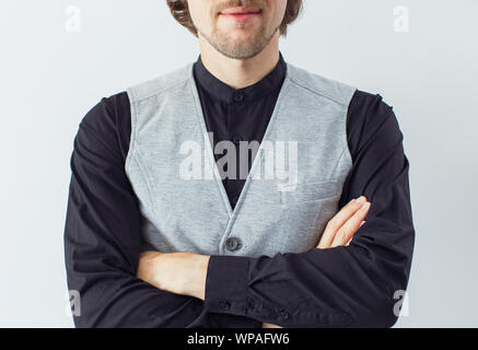 Young bearded attractive business man in black shirt with gesture of confidence isolated on white background. Fashion concept Stock Photo