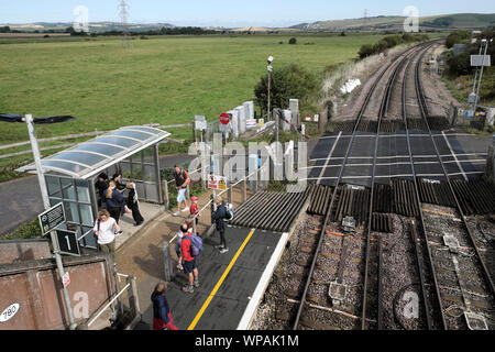 People tourists travellers waiting on Southease Station platform for a train heading to Brighton East Sussex in summer England UK  KATHY DEWITT Stock Photo