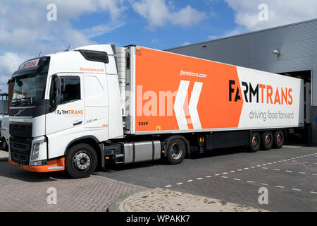 Farm Trans truck at loading dock. Farm Trans was founded in 1987 with a focus on bulk transport within the world of food transport. Stock Photo