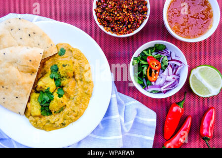 Traditional Indian Chicken Korma Curry Meal With Naan Bread Stock Photo