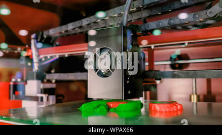 Three dimensional printer machine working at modern technology exhibition Stock Photo