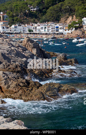 Rocky headland and beach in Tamariu Catalunya Spain Stock Photo