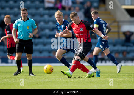 Dundee, Scotland, UK. 8th September 2019; Dens Park, Dundee, Scotland; Scottish Challenge Cup, Dundee Football Club versus Elgin City; Shane Sutherland of Elgin City and Max Anderson of Dundee - Editorial Use Only. Credit: Action Plus Sports Images/Alamy Live News Stock Photo