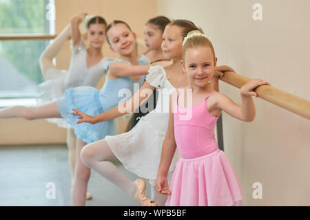 Happy smiling ballerina in pink suit. Stock Photo