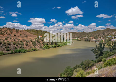 Rio Guadiana, view from Spanish side, village of Pomarao in Portugal in distance, Guadiana Valley Natural Park, Beja district, Baixo Alentejo Portugal Stock Photo