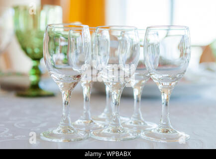 Glasses on a laid served wedding table, close-up Stock Photo