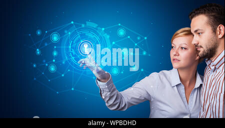Man touching hologram screen displaying keys and locks Stock Photo