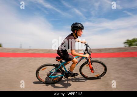 11 year old boy riding mountain bike hi res stock photography and