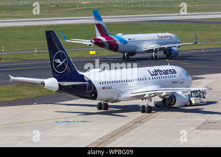 Dusseldorf, Germany – March 24, 2019: Lufthansa and Eurowings Airbus airplanes at Dusseldorf airport (DUS) in Germany. Stock Photo