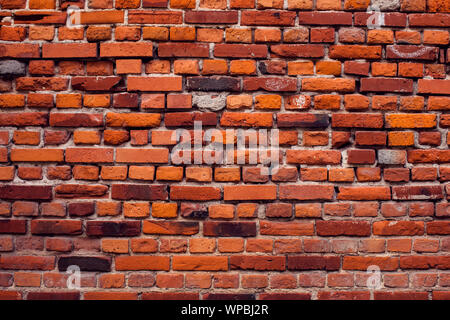 Red vintage bricks wall background. Old building surface Stock Photo