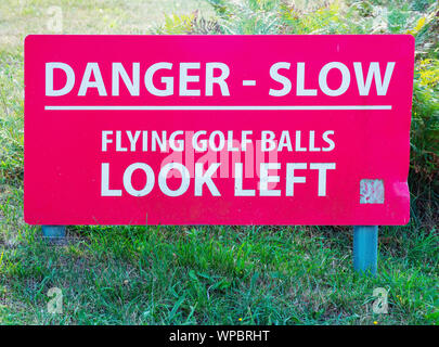 Golf warning sign at Royal Jersey Golf Club, Jersey, Channel Islands. Stock Photo